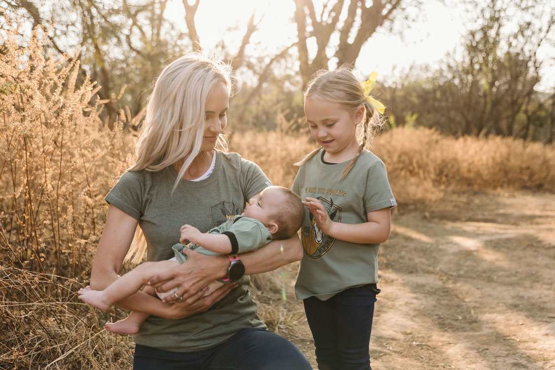 Mother and children in matching REPUBLK tees outdoors